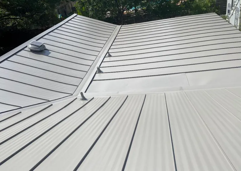 Solar attic fan installed on a metal roof for Roof Ventilation in Berkley